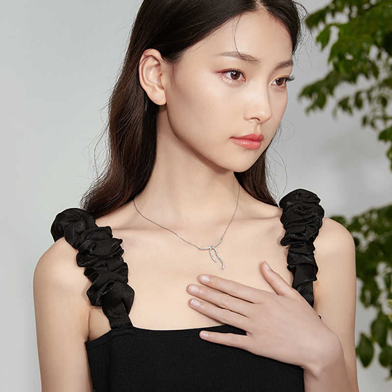 LAIS Niche Design Women's Zircon Bow Necklace, Stainless Steel Material, Plated White Gold Cross - Chain is Elegant and Charming