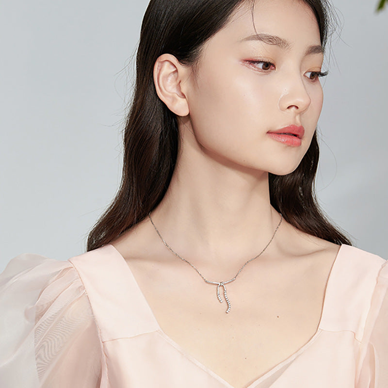 LAIS Niche Design Women's Zircon Bow Necklace, Stainless Steel Material, Plated White Gold Cross - Chain is Elegant and Charming